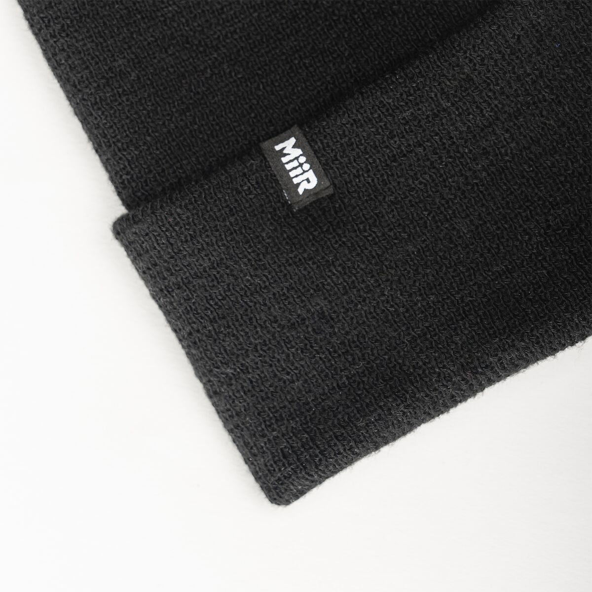 recycled-poly-fine-knit-beanie-g2 WebPDP-RecycledPolyFineKnitBeanie_Studio_TagDetail_Black__BNE005002OS.jpg