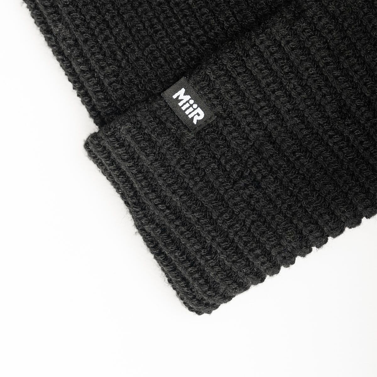 recycled-poly-rib-beanie-w8 WebPDP-RecycledPolyRibBeanie_Studio_TagDetail_Black__BNE002002OS.jpg
